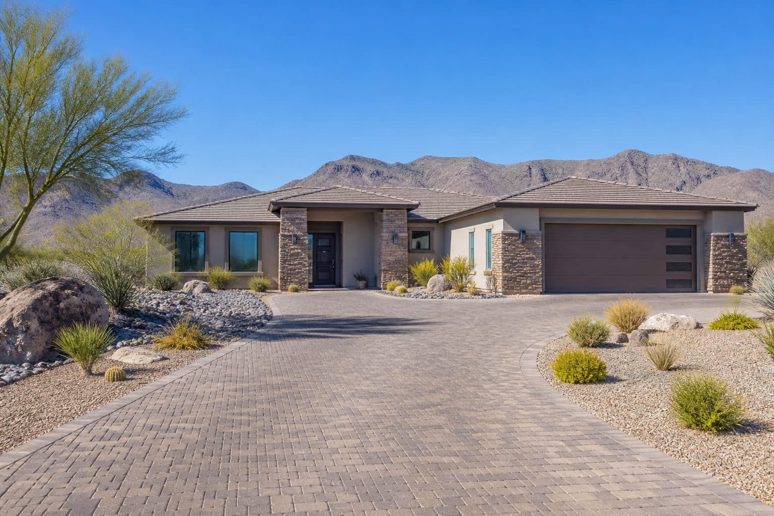 Single-level Nevada home with a wide paved arrival route and a zero-step covered door.