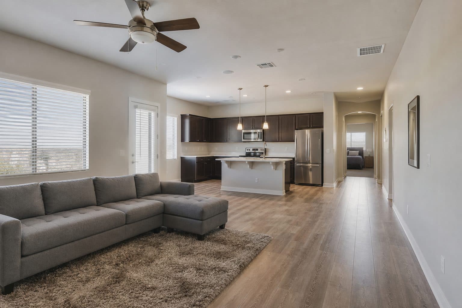 Open floor from living room to kitchen and a bedroom hall, one finished level, no stair.